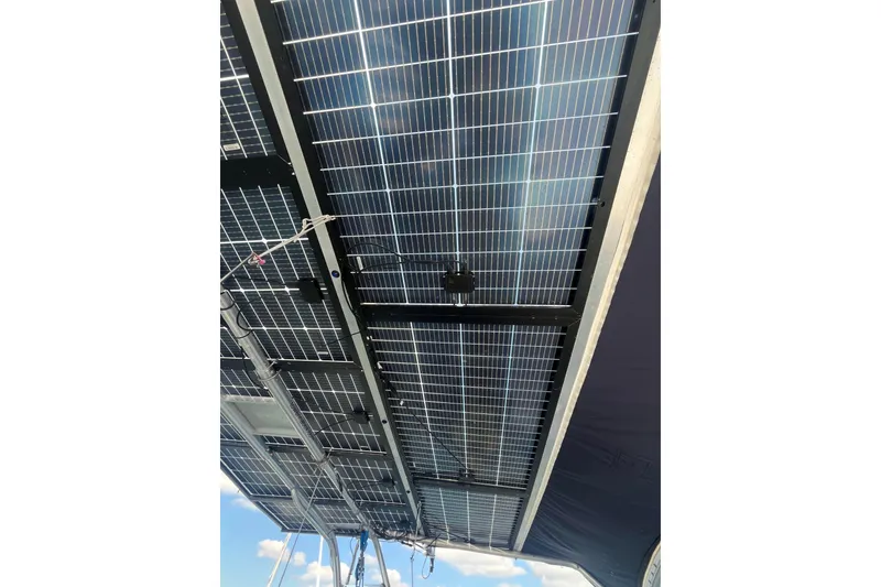 Slide: The Image of Solar panels on a 2000 Fountaine Pajot Belize 43 catamaran, viewed from below. - 24