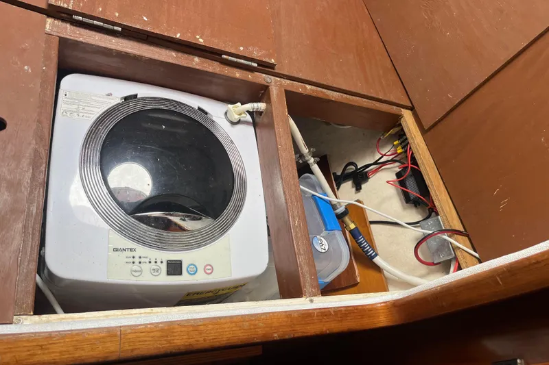 Slide: The Image of Washing machine installed in a 2000 Fountaine Pajot Belize 43 yacht's wooden compartment. - 26