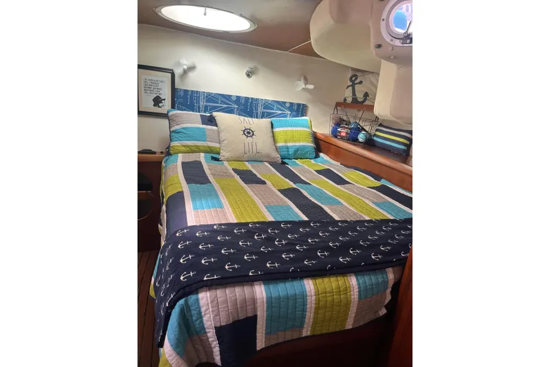 Slide: The Image of Cozy cabin bedroom in 2000 Fountaine Pajot Belize 43 catamaran with nautical decor. - 31