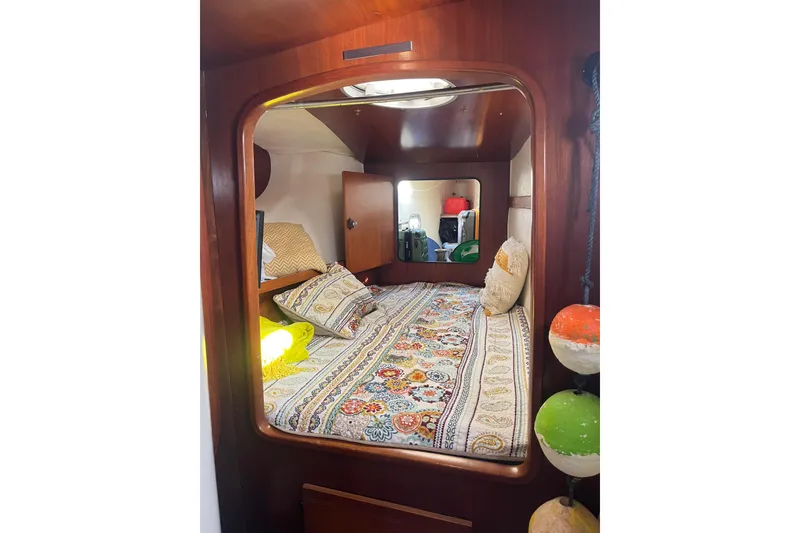 Slide: The Image of Cozy cabin interior of 2000 Fountaine Pajot Belize 43 with colorful bedding. - 15