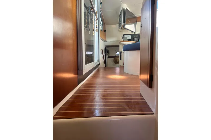 Slide: The Image of Interior view of 2000 Fountaine Pajot Belize 43 catamaran with wooden flooring and modern design. - 29