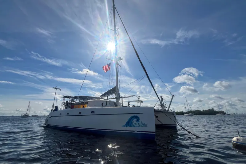 Slide: The Image of Fountaine Pajot Belize 43 catamaran, 2000 model, sailing under a bright blue sky. - 3