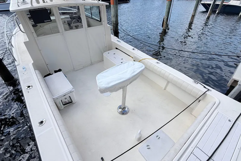 Slide: The Image of 2001 Parker 2520 Deep Vee Sport Cabin boat on open water, aerial view. - 3