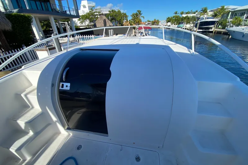 Slide: The Image of 2004 Deep Impact 36 DI boat deck with canal view, featuring sleek design and modern amenities. - 17