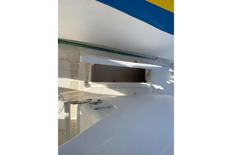 Slide: The Image of 2004 Deep Impact 36 DI boat interior with open storage compartment. - 26