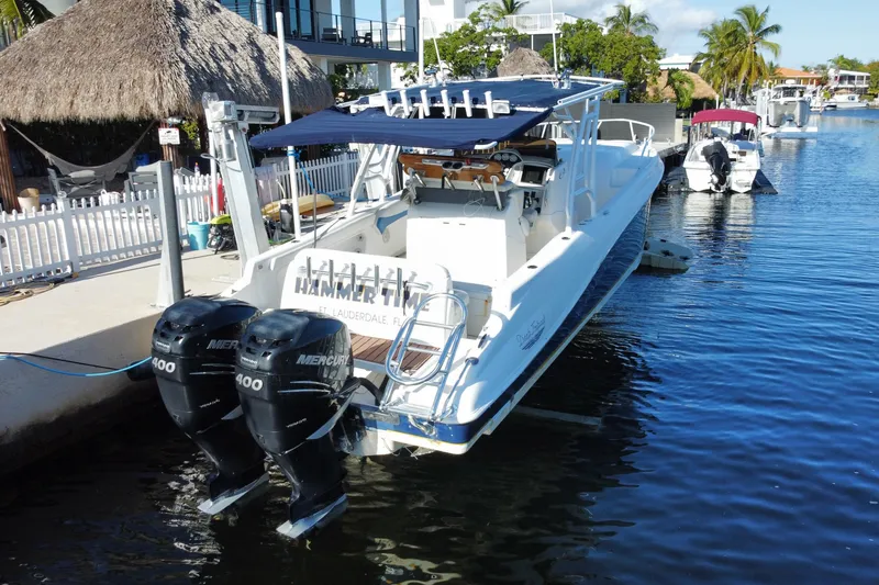 Slide: The Image of 2004 Deep Impact 36 DI boat docked with dual Mercury 400 engines. - 34