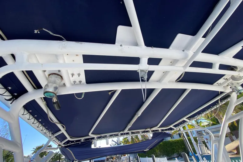 Slide: The Image of 2004 Deep Impact 36 DI boat canopy with white frame and blue cover. - 39