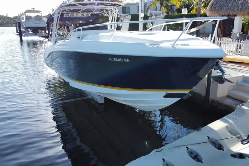 Slide: The Image of 2004 Deep Impact 36 DI boat docked in a marina, side view. - 4