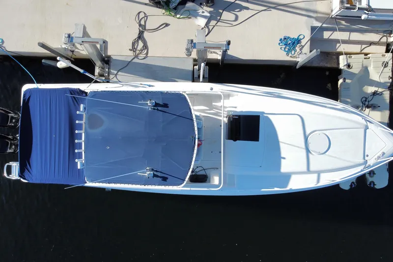 Slide: The Image of Overhead view of a 2004 Deep Impact 36 DI boat docked at a marina. - 42