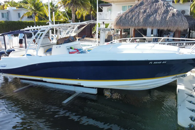 Slide: The Image of 2004 Deep Impact 36 DI boat docked near tropical waterfront home. - 5