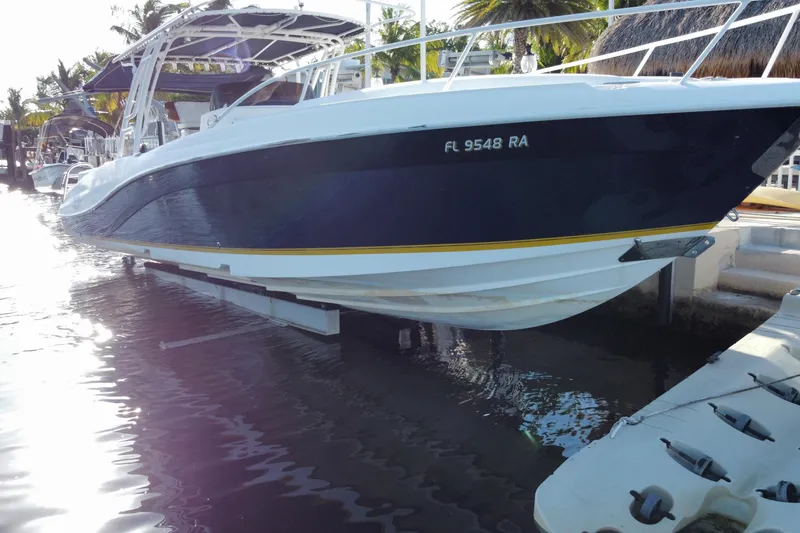 Slide: The Image of 2004 Deep Impact 36 DI boat docked in sunny marina setting. - 6