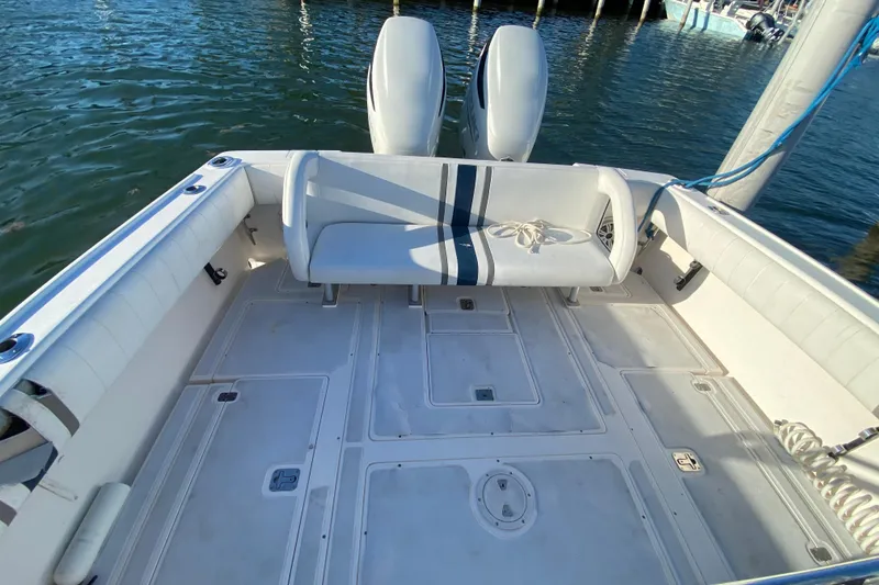 Slide: The Image of 1998 Intrepid 339 boat deck with seating, docked by the water. - 29