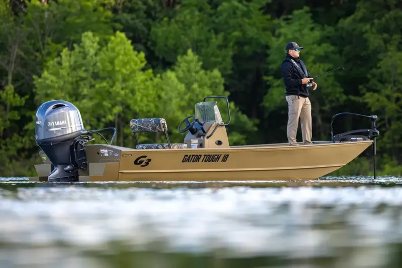 The Image of 2026 G3 Gator Tough 18 CCT boat on trailer, parked against a white wall. - 1