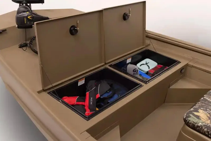 Slide: The Image of 2026 G3 Gator Tough 18 CCT boat on trailer, camo seats, parked outdoors. - 3