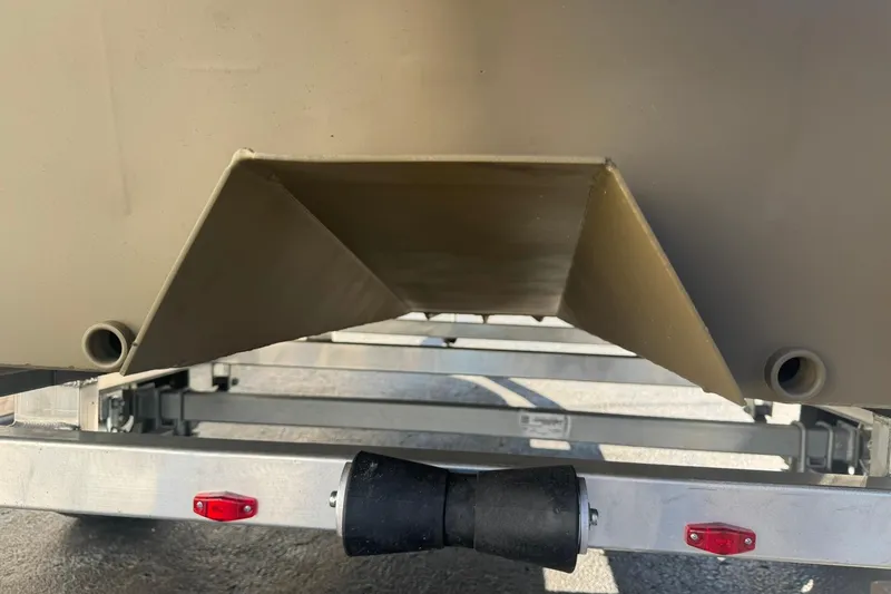 Slide: The Image of 2026 G3 Gator Tough 18 CCT boat hull on trailer, close-up view. - 8