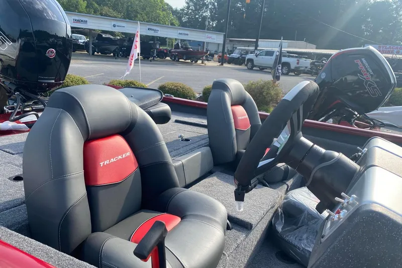 Slide: The Image of 2025 Tracker Pro Team 195 Tournament Edition boat interior with steering wheel and seats. - 4