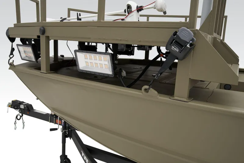 Slide: The Image of Manufacturer Provided Image: 2025 Tracker Grizzly 2072 CC Sportsman boat with mounted lights on a trailer. - 10