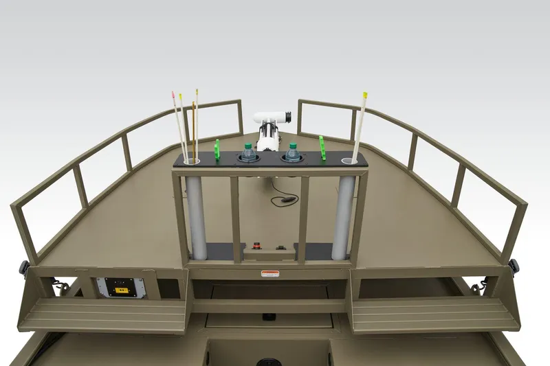 Slide: The Image of Manufacturer Provided Image: 2025 Tracker Grizzly 2072 CC Sportsman boat deck with fishing rod holders and railing. - 13