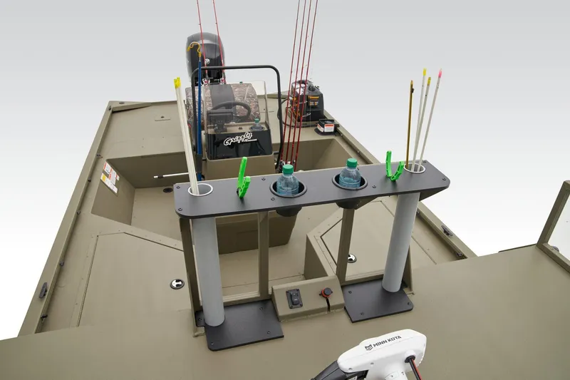 Slide: The Image of Manufacturer Provided Image: 2025 Tracker Grizzly 2072 CC Sportsman boat interior with fishing rod holders and equipment. - 16