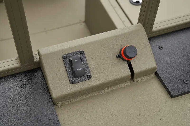 Slide: The Image of Manufacturer Provided Image: Control panel of 2025 Tracker Grizzly 2072 CC Sportsman boat, featuring a switch and knob. - 18