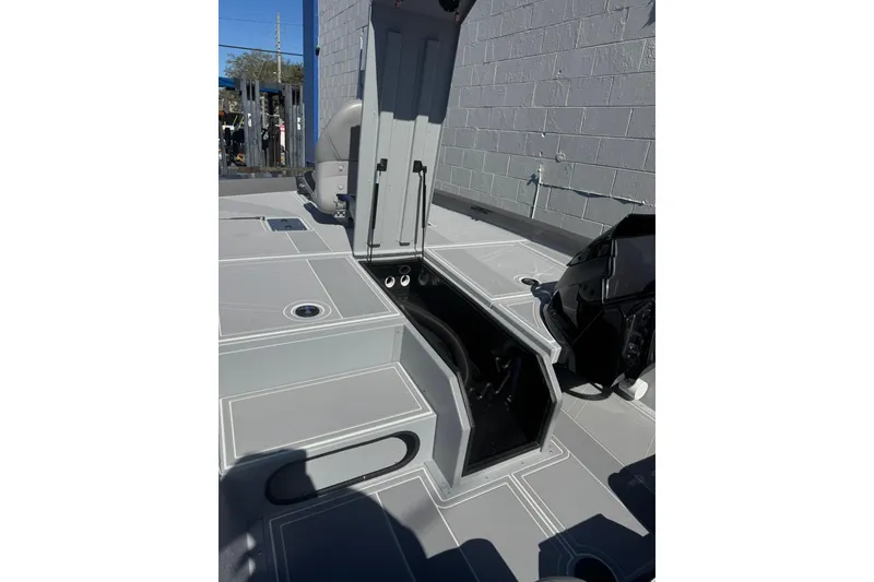 Slide: The Image of 2026 G3 Sportsman 1810 SE boat interior with open storage compartment. - 10