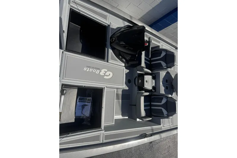 Slide: The Image of 2026 G3 Sportsman 1810 SE boat interior with seating and storage compartments. - 11