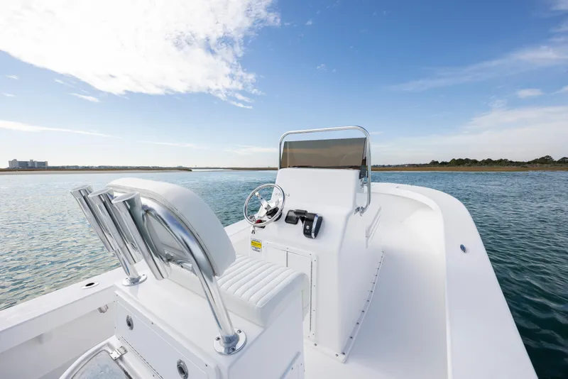 Slide: The Image of 2026 Privateer ROAMER II boat on calm water under clear blue sky. - 11