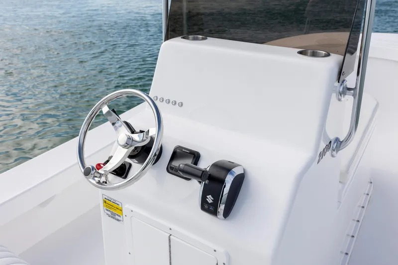 Slide: The Image of 2026 Privateer ROAMER II boat console with steering wheel and controls. - 12