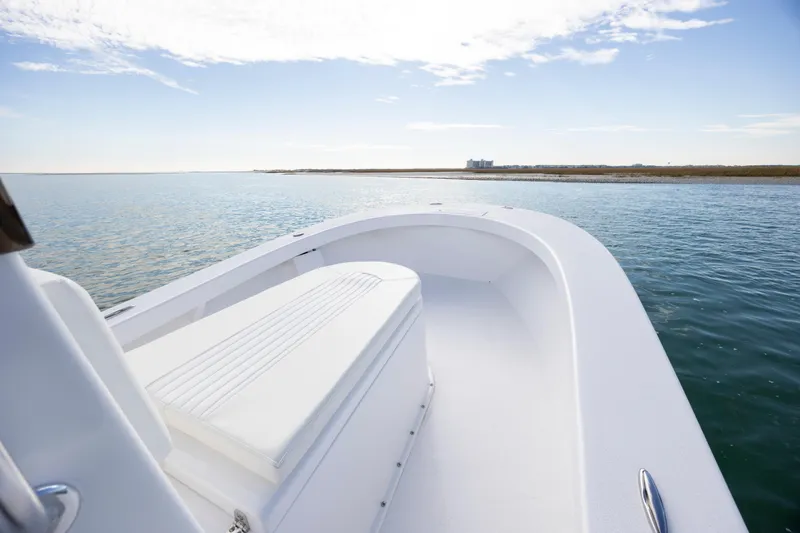 Slide: The Image of Privateer ROAMER II 2026 boat on calm water under a clear sky. - 14