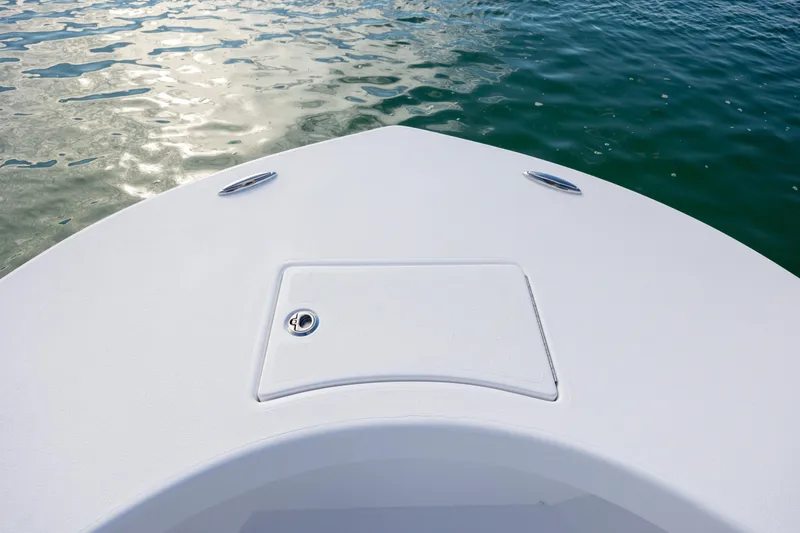 Slide: The Image of Bow of 2026 Privateer ROAMER II boat on calm water. - 16