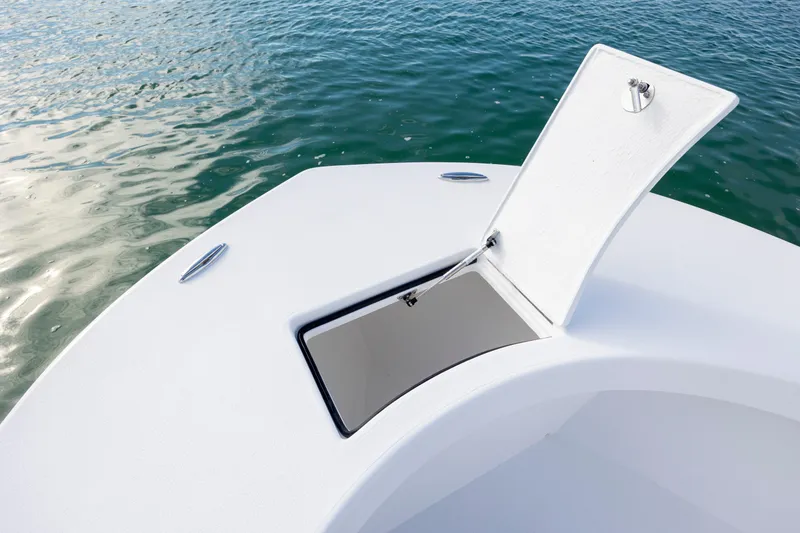 Slide: The Image of Open hatch on 2026 Privateer ROAMER II boat, with water in the background. - 17
