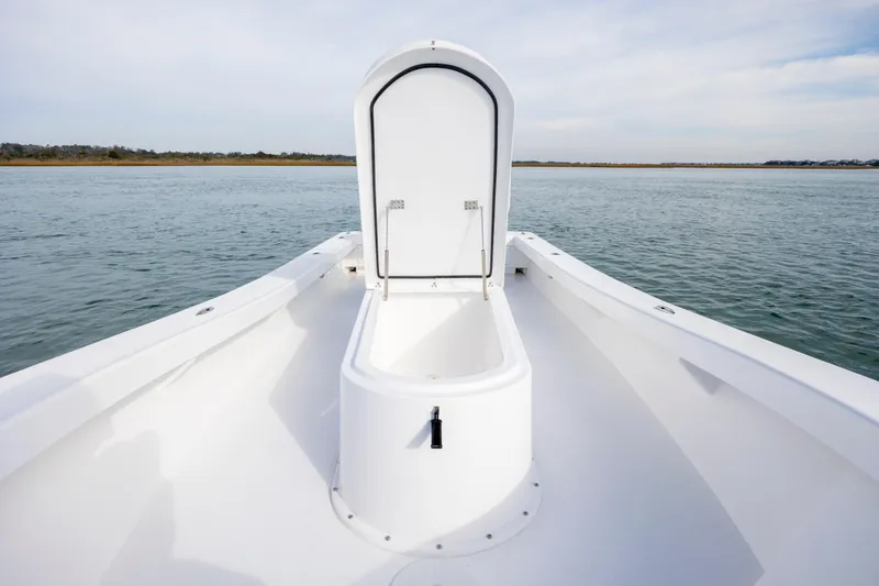 Slide: The Image of Bow view of 2026 Privateer ROAMER II boat with open storage compartment. - 18