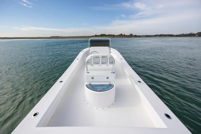 Slide: The Image of Privateer ROAMER II 2026 boat on calm water under a clear sky. - 7