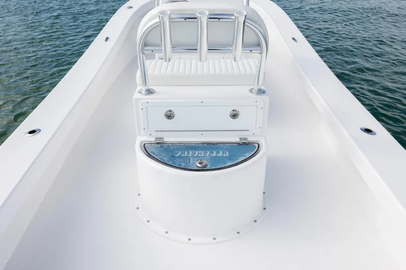 Slide: The Image of Privateer ROAMER II 2026 boat deck with seating and rod holders on calm water. - 9