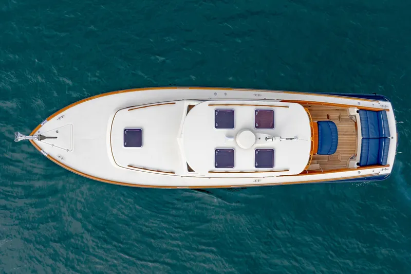 Slide: The Image of Top view of 2003 Hinckley Picnic Boat EP on blue water. - 14