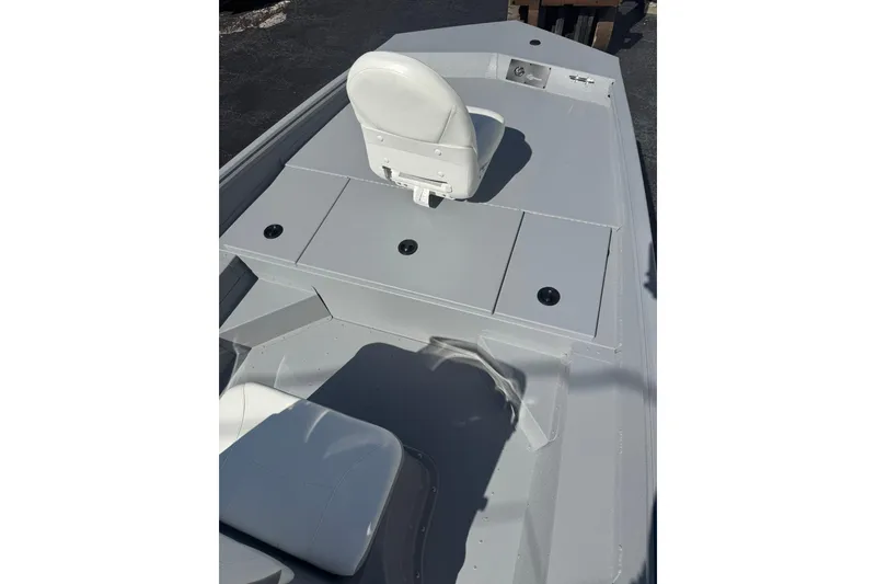 Slide: The Image of 2026 G3 Bay 17 boat interior with white seating and storage compartments. - 6