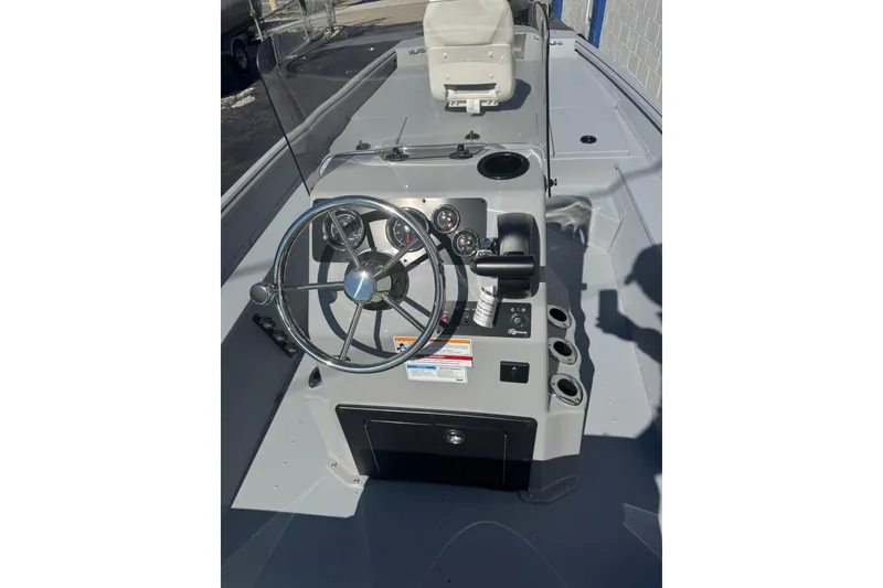 Slide: The Image of 2026 G3 Bay 17 boat console with steering wheel and controls. - 9