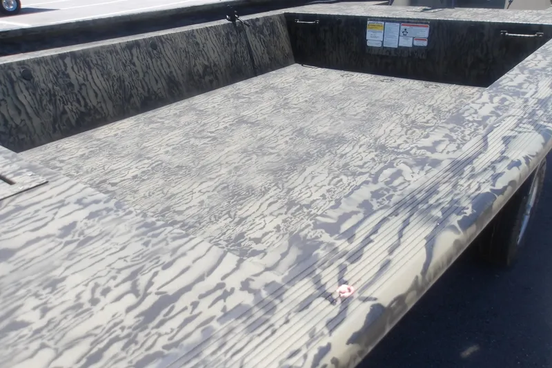 Slide: The Image of 2026 Tracker Grizzly 1648 SC boat interior with camouflage pattern design. - 9