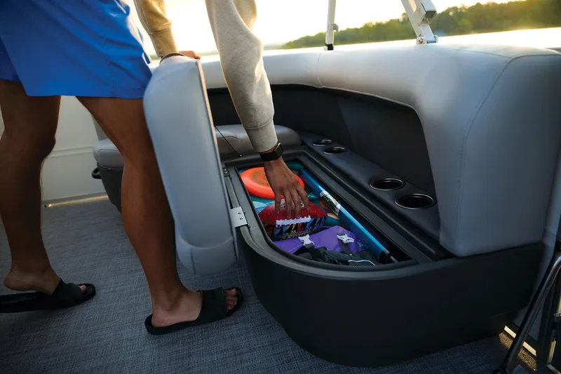 Slide: The Image of 2026 Sun Tracker Party Barge 16 DLX interior with seating and steering console. - 8