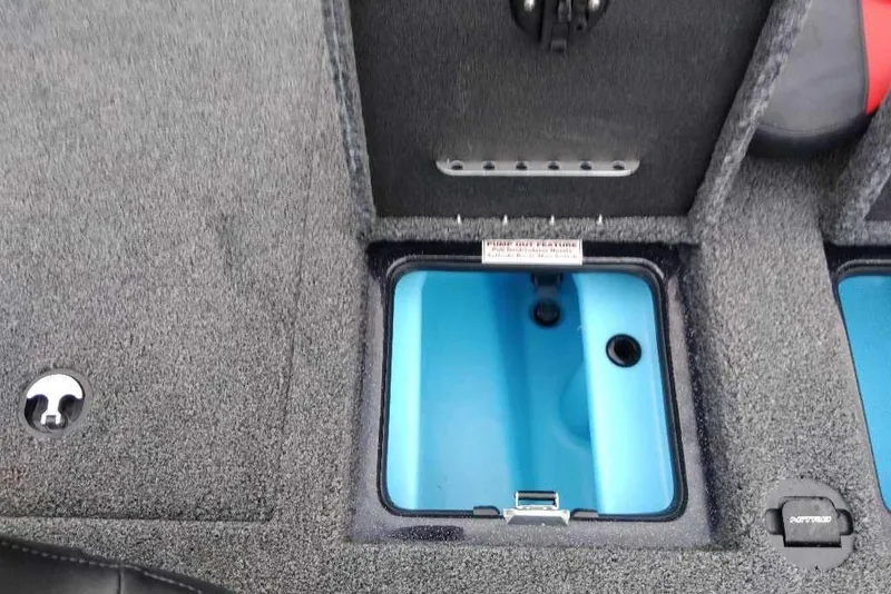 Slide: The Image of 2026 Nitro Z20 XL Pro boat storage compartment with blue interior and carpeted exterior. - 122