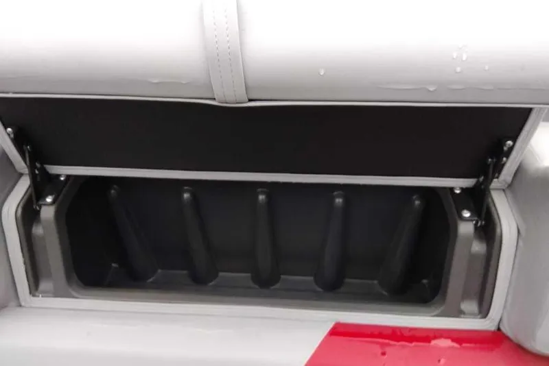 Slide: The Image of 2026 Sun Tracker Party Barge 22 XP3 storage compartment with open lid. - 93