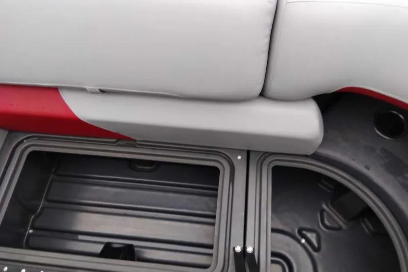 Slide: The Image of 2026 Sun Tracker Party Barge 22 XP3 storage compartment with cushioned seating. - 94