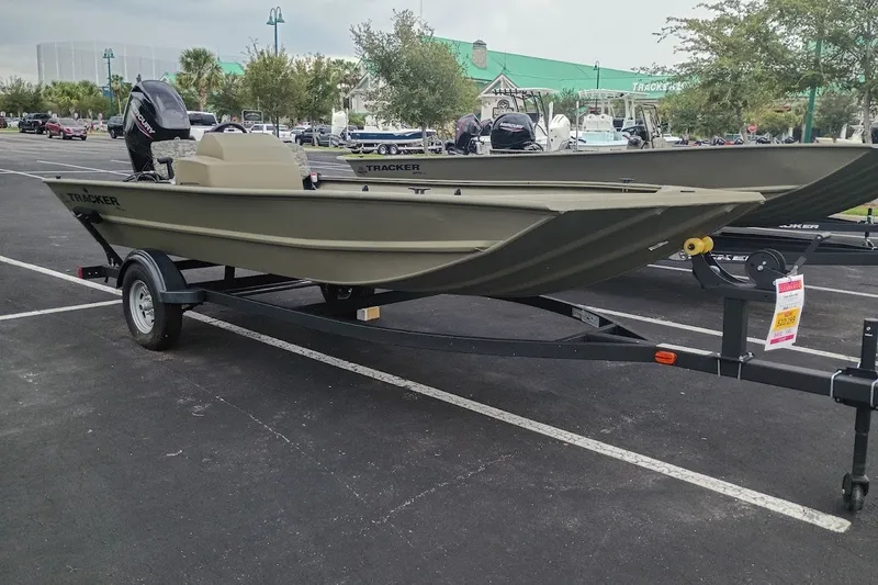 The Image of 2026 Tracker Grizzly 1754 SC boat on trailer in parking lot. - 0