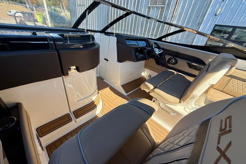 Slide: The Image of Interior of a 2016 Sea Ray 280 SLX boat with luxurious seating and modern dashboard. - 11