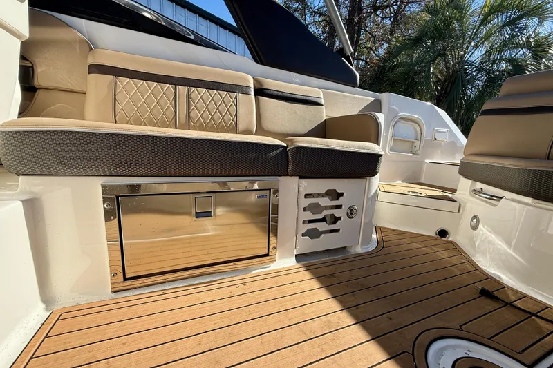 Slide: The Image of Luxurious interior of 2016 Sea Ray 280 SLX boat with elegant seating and teak flooring. - 15