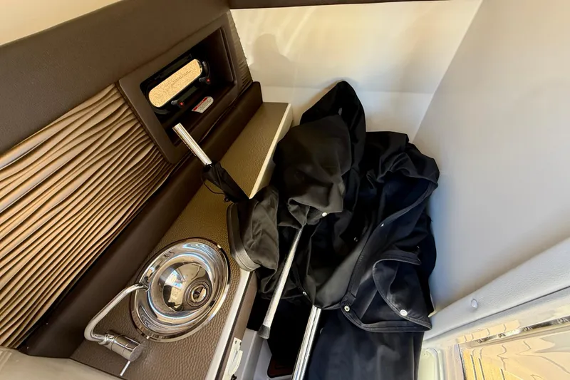 Slide: The Image of Interior of 2016 Sea Ray 280 SLX boat with storage compartment and accessories. - 16