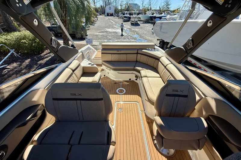 Slide: The Image of Luxurious interior of 2016 Sea Ray 280 SLX boat with elegant seating and wood flooring. - 9