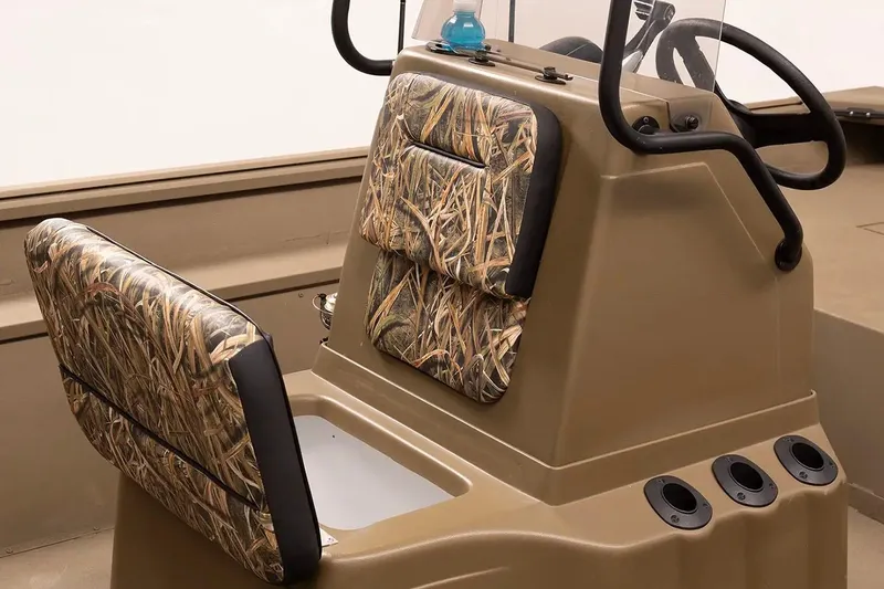 Slide: The Image of Manufacturer Provided Image: 2026 G3 Gator Tough 18 CC boat interior with camo seats and console. - 4