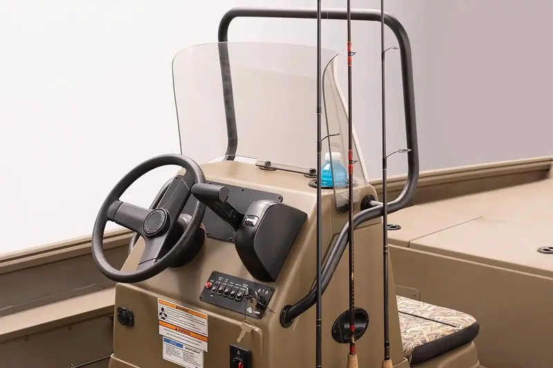 Slide: The Image of Manufacturer Provided Image: 2026 G3 Gator Tough 18 CC boat console with steering wheel and fishing rods. - 5