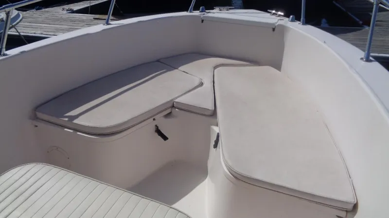 Slide: The Image of 2001 Grady-White Escape 209 boat with cushioned bow seating area. - 10